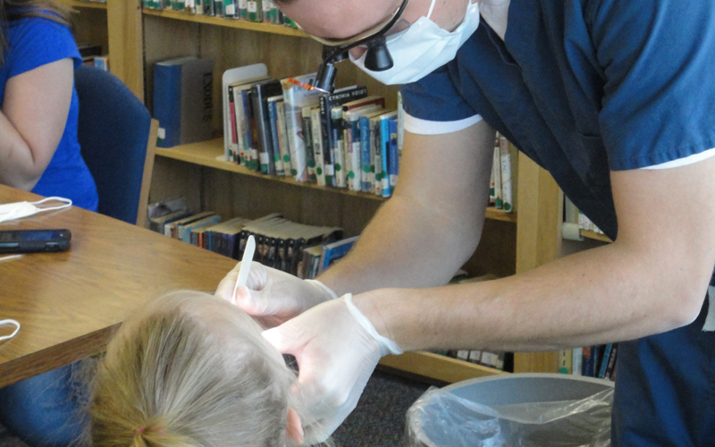 Dr Kruse working on a patient