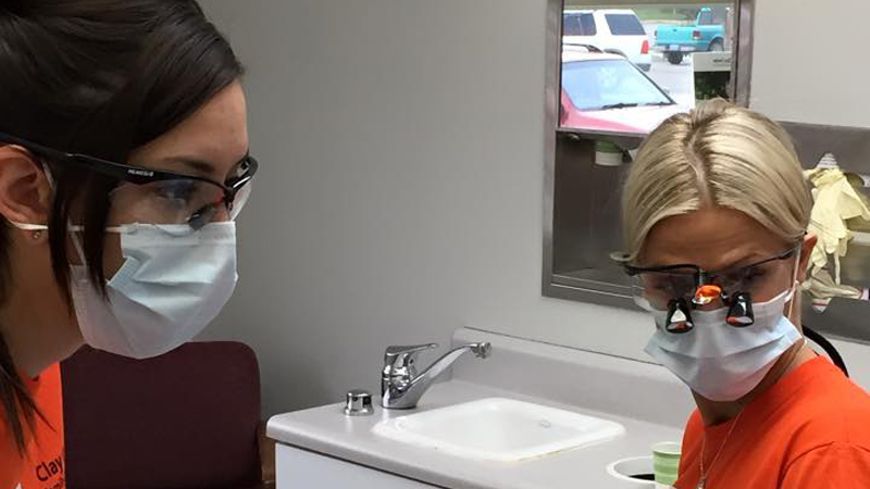 Two female team members on Clay Center Family Dental Care Dental Mission day