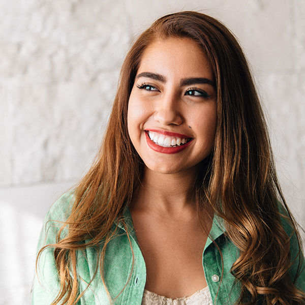 young woman smiling indoors