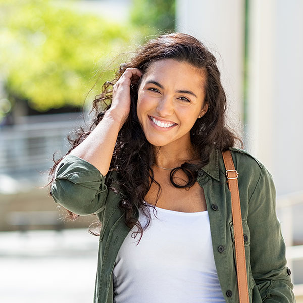 woman smiling outdoors