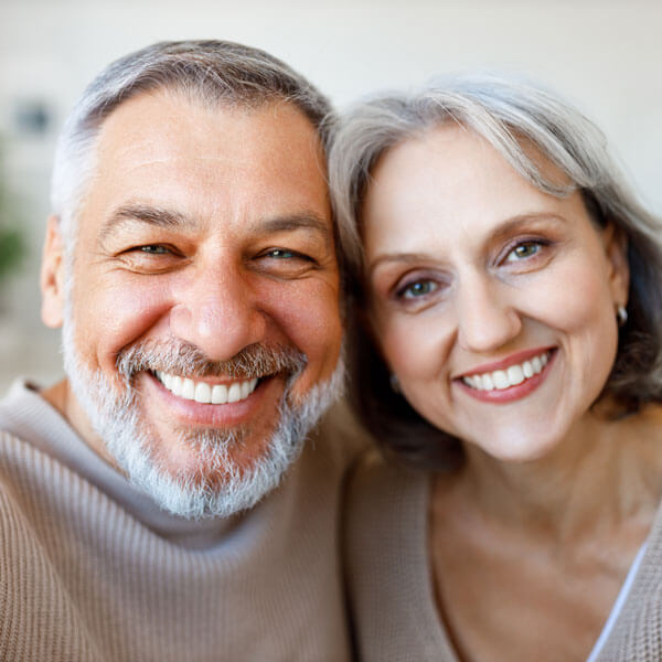 mature man and woman smiling together