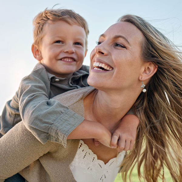 mother and son smiling together