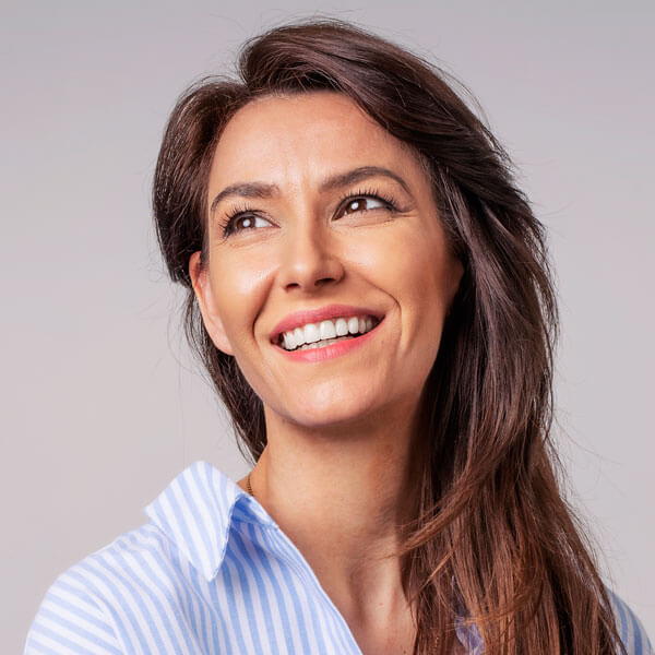 woman with dark hair smiling