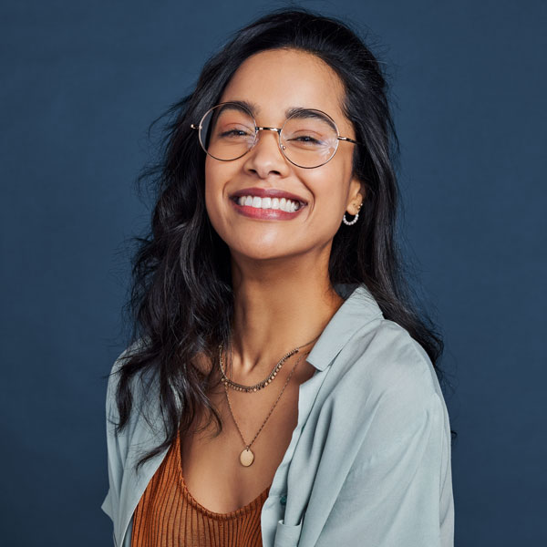 young woman with dark hair smiling