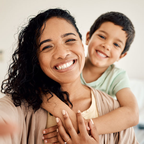 mother and son smiling together